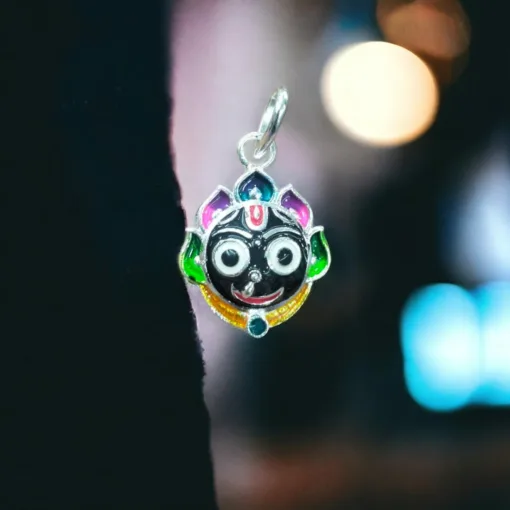 Person wearing the silver Jagannath locket with Nila Chakra, feeling a deeper connection to their faith.