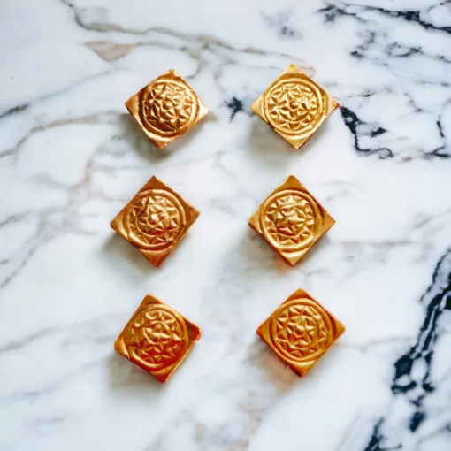 Sunaphula ornaments placed on Jagannath deities, enhancing a home puja space with traditional elements.