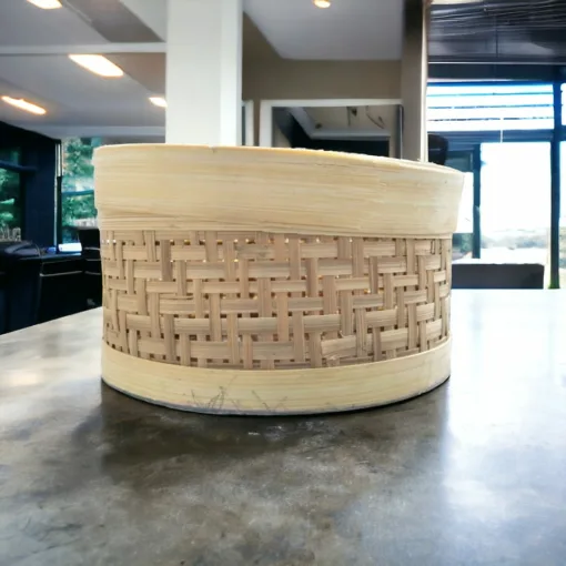 Enhance the beauty of your home with this handcrafted bamboo basket, adding a touch of natural charm.