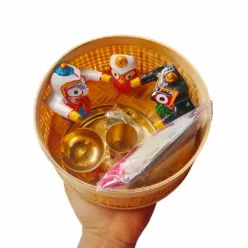 Shri Jagannath's Blessings Gift Hamper, including a 2-inch neem wood murti, silver locket, brass puja kit, and Jagannath cloth."