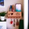 Key stand with multiple hooks for organizing keys, plus a shelf for holding a mobile phone and pen.