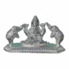 Lakshmi Murti, adorned with golden coins, symbolizing the flow of wealth and prosperity.