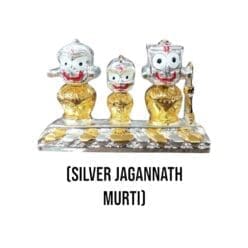 Small Silver Jagannath murti with Nirmalya Mahaprasadam and Sanjua for puja rituals.