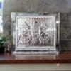 Silver Jagannath Murti placed on an altar, enhancing the puja space with its elegant presence.