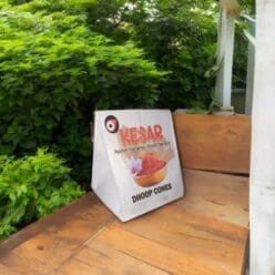 Burning keshar dhoop, with smoke rising.